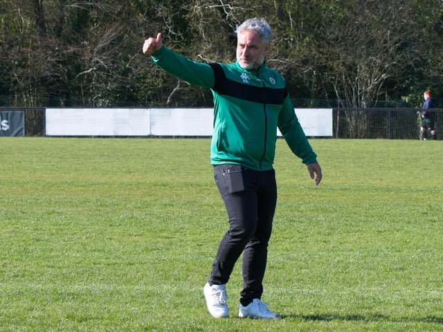 Burgess Hill Town players, fans and staff celebrate surviving in the Isthmian south east division at the end of their 0-0 draw with Beckenham
