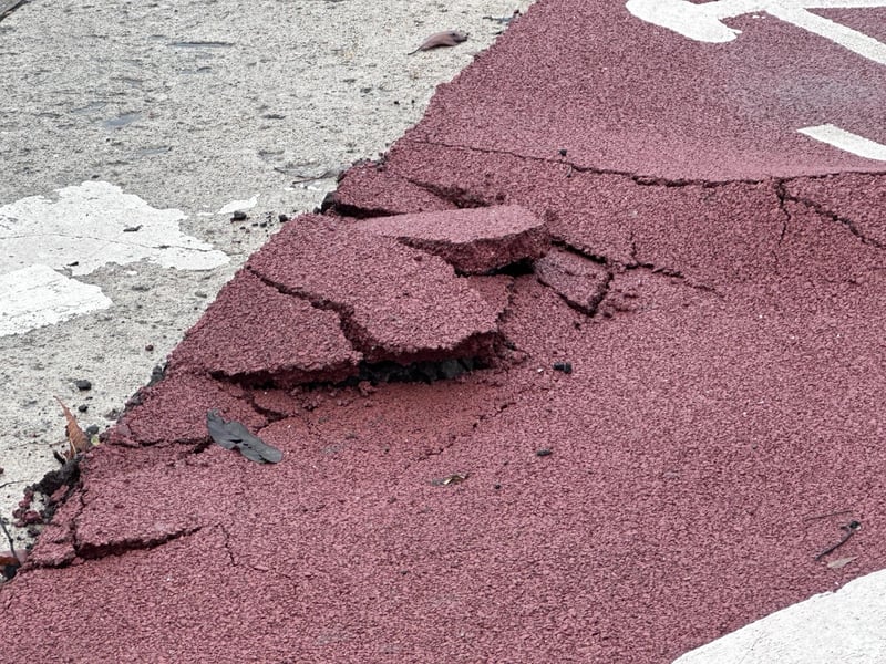 Part of the pavement on Hastings seafront has been damaged following torrential rain. Picture: John Bownas