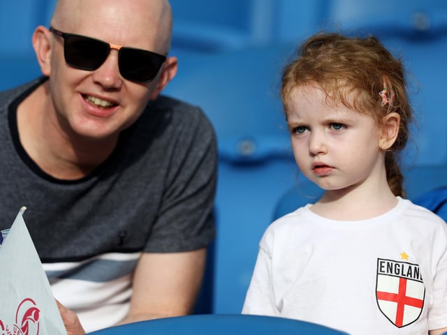 An England fan looks on inside the stadium.