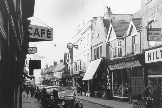 Shops - and cars! - in West Street, Horsham, in the 1950s. Photo contributed by Barry Stephenson.