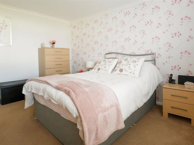 To the front of the property are two generously-proportioned double bedrooms