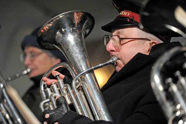 A member of the Salvation Army playing with the brass band