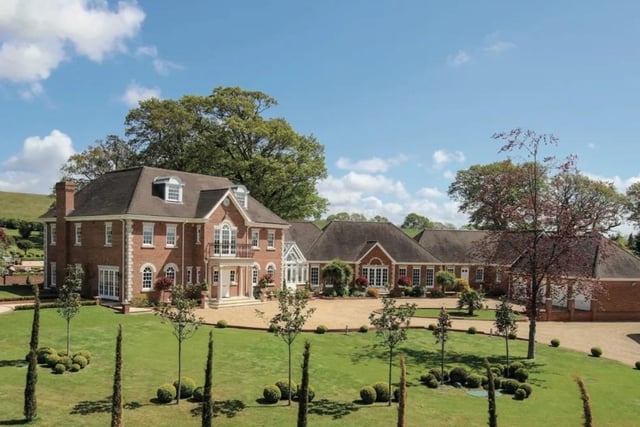 This property is on the market with Sotheby's International Realty - Cobham for a guide price of £8,500,000.
Alongside the 11 beds, 11 baths, and six receptions it has an indoor and an outdoor pool, gym and detached two bedroom guest bungalow.