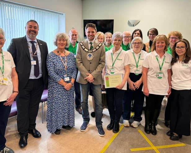QVH Macmillan Centre team with members of the senior team at QVH and the local Mayor