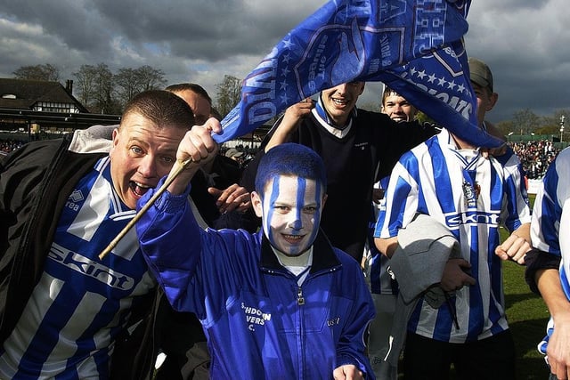 Brighton & Hove Albion fans celebrate winning the Division Two title after the Nationwide League Division Two match against Swindon Town played at the Withdean Stadium on April 13, 2002.