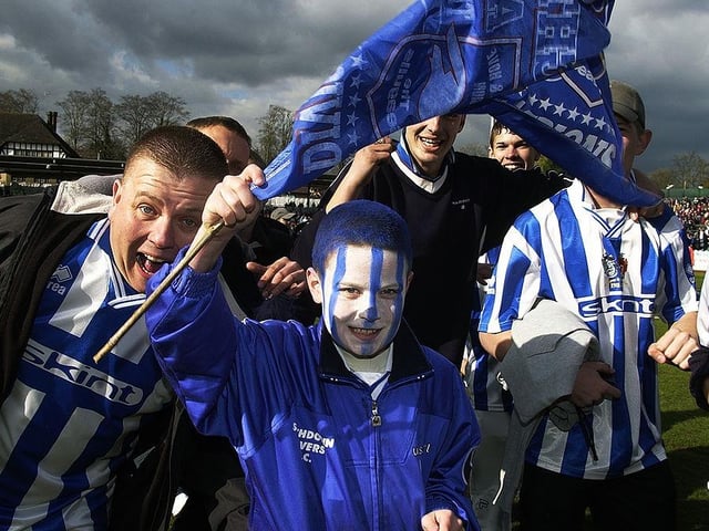 Brighton & Hove Albion fans celebrate winning the Division Two title after the Nationwide League Division Two match against Swindon Town played at the Withdean Stadium on April 13, 2002.