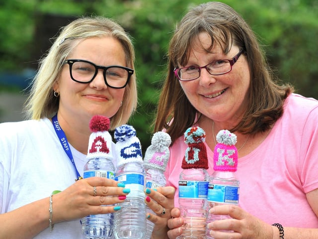 Laura Newell from Age UK West Sussex, left, with Elizabeth Benson, treasurer at Arcade Knitters