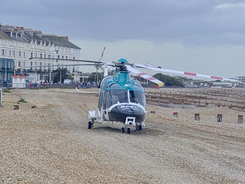 An air ambulance lands on the beach.