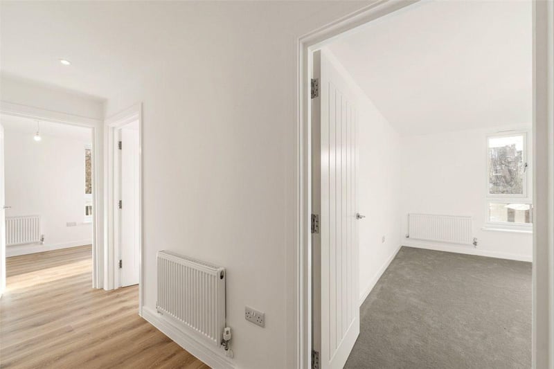 This apartment with balcony on the second floor is priced at £275,000. The master bedroom is a double and there is a kitchen / dining room with double doors to the living room, which could potentially be used as a second bedroom.