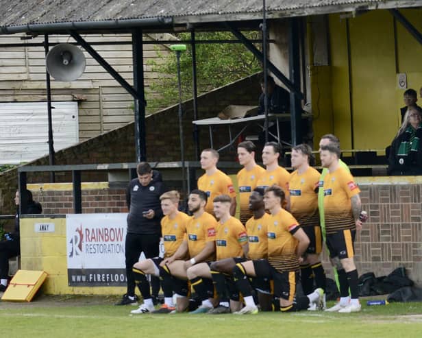 Littlehampton Town's players pose for a team picture last Saturday at the final game they will play in front of the old stand, due to be replaced in the summer | Picture: Stephen Goodger