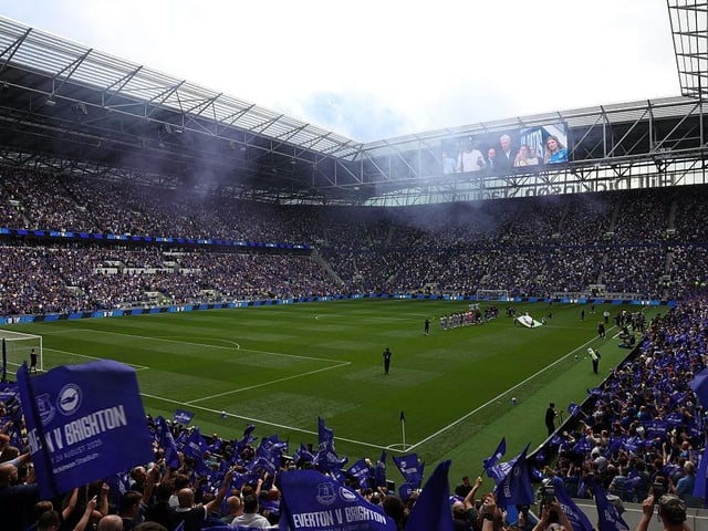 Players walk out onto the pitch ahead of the English Premier League football match between Everton and Brighton and Hove Albion at Hill Dickinson Stadium
