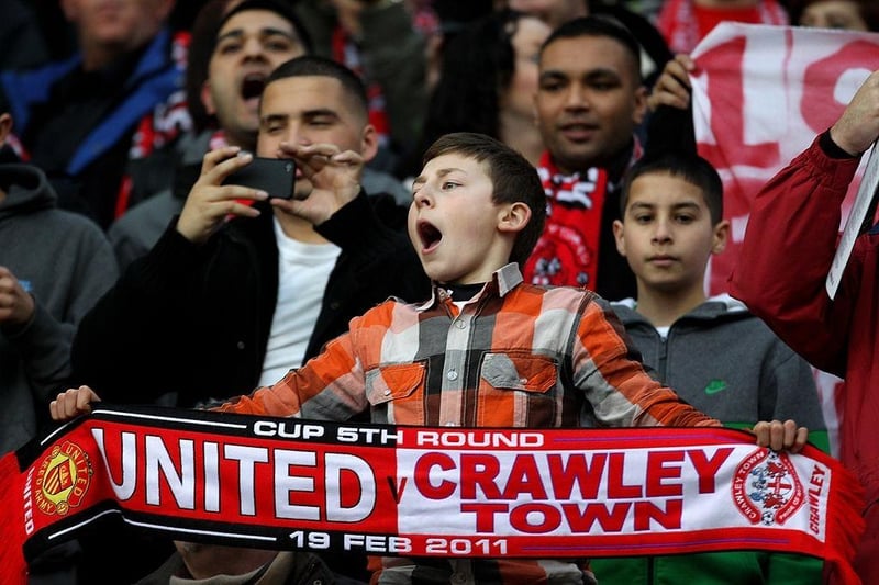 A young Crawley Town fan shows his support.