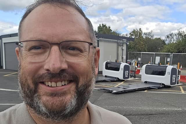 Here I am with a couple of the robots behind me