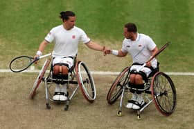 Gordon Reid (L) and Alfie Hewitt (R) of Great Britain in action at Wimbledon in 2023 (Photo by Clive Brunskill/Getty Images)