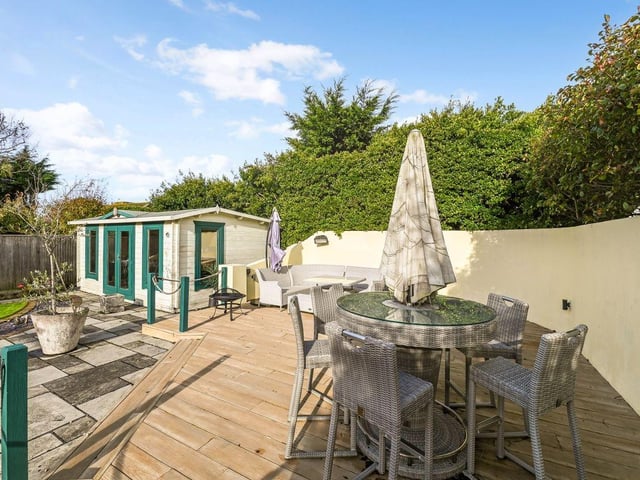 The wooden patio gives the garden a sense of diversity and character.