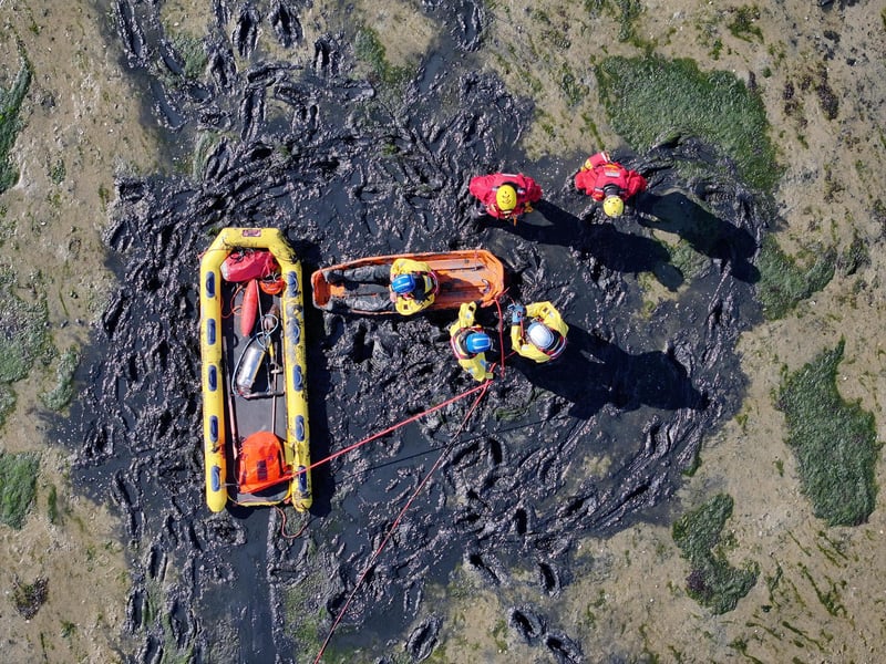 Both agencies worked together to rescue casualties from mud.