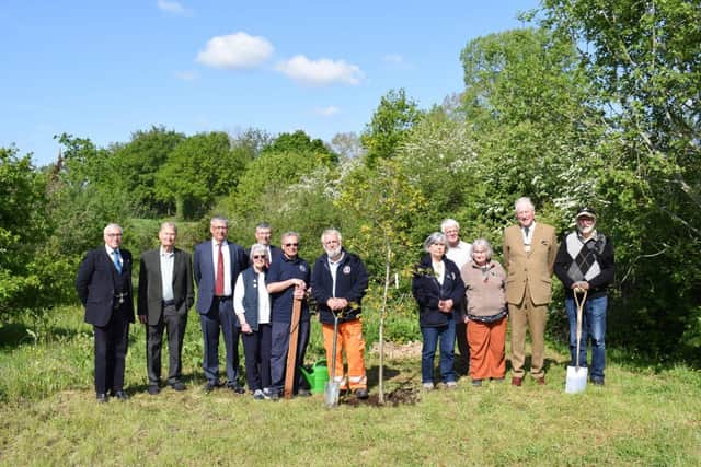 Deputy Lieutenant of East Sussex John Moore-Bick (second from right) with the Chairman and Directors of the K&ESR plus forestry and station volunteers at the tree planting at Bodiam