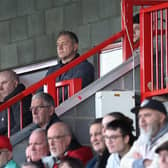 Crawley Town boss watched the game from stands while serving his two-match ban. Picture: Natalie Mayhew/Butterfly Football