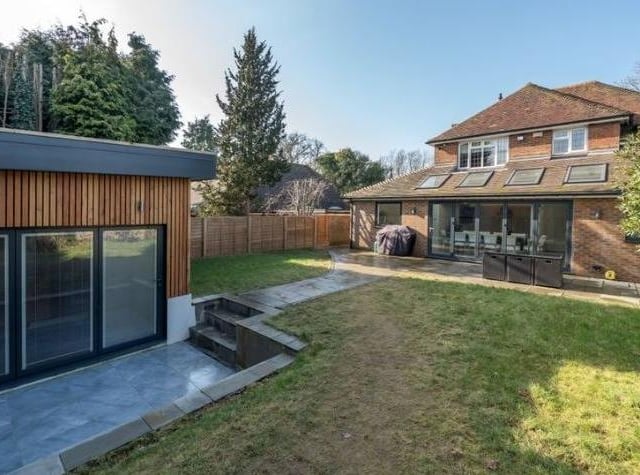 To the rear of the house is the studio/spa/hot tub