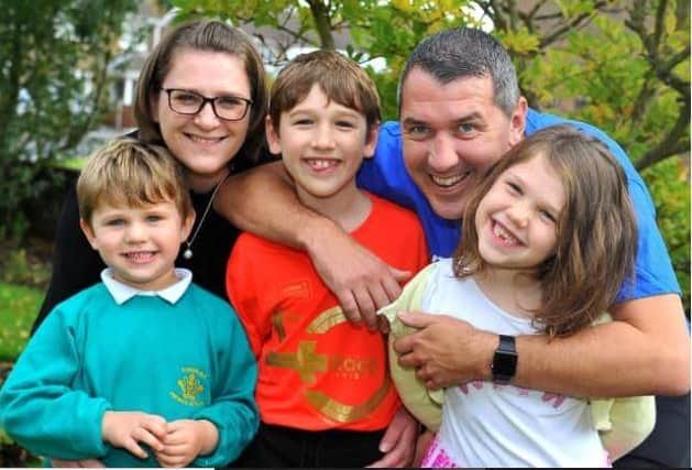 Caroline and Martin Comper with their children Ollie, Jack and Poppy. Family and friends are fundraising for the Motor Neurone Disease Association after Martin was diagnosed with the disease two years ago