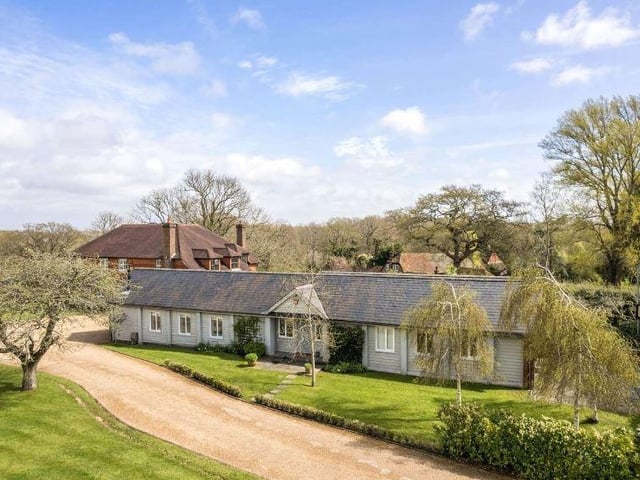 The annexe is self-contained and finished to the same high standards as the main house. It comprises an entrance hall, sitting room, kitchen/dining room, two bedrooms (one en-suite), a shower room and a WC. It has its own access from the drive and a private section of patio adjoining the barn