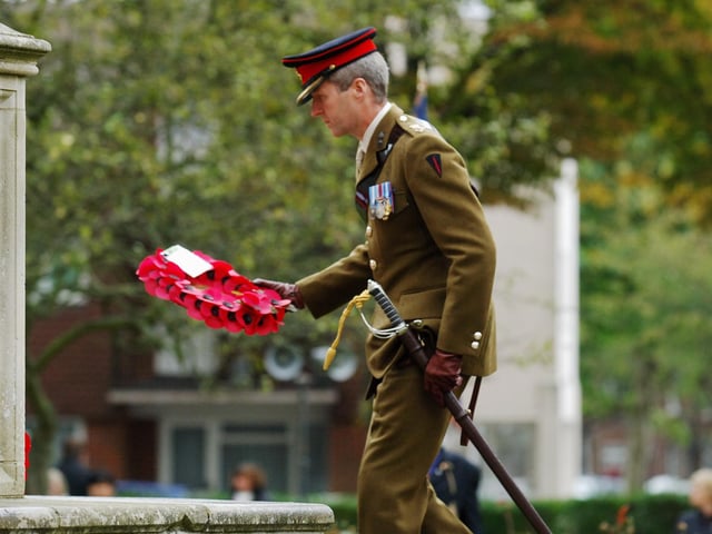 Colonel Mike Kelly lays a wreath in memory of those who gave their lives for their country