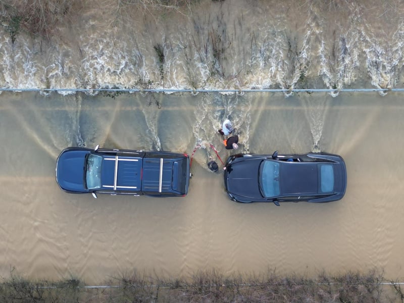 Members of the public helped drivers stuck in the flood water on the route from Billingshurst to Wisborough Green on Friday, January 5