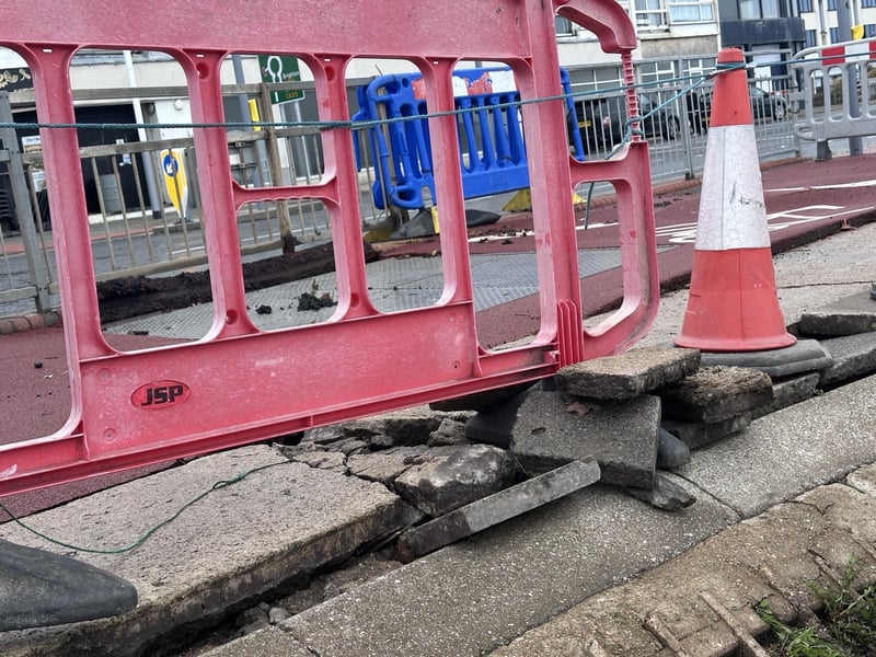 Part of the pavement on Hastings seafront has been damaged following torrential rain. Picture: John Bownas