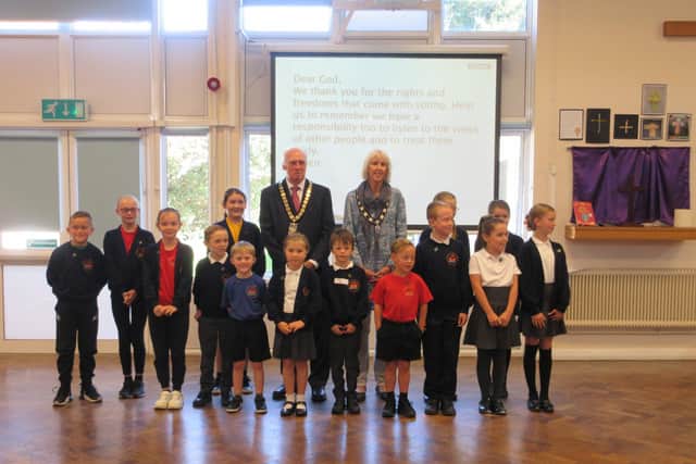 Cllr John Barrett and consort Ms Carole Brett with students at South Bersted Primary School