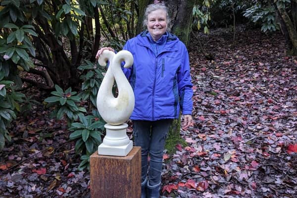 Bronwyn Sibley with her sculpture 'Having Each Other's Back