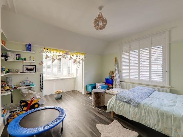 Bedroom three is double aspect with two walk-in storage cupboards