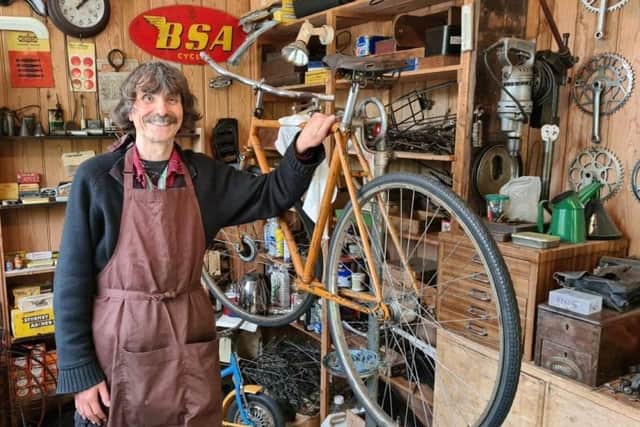 Volunteer Nic Strain working on a 1940s Raleigh Super Sport for the cycle exhibition. It still has the original Brooks England saddle and a four-speed hub, with dynamo and aftermarket brakes. Picture: Amberley Museum / Submitted