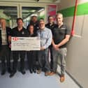 Members of the Hastings Round Table presenting a cheque to The Friends of Conquest Hospital