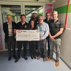 Members of the Hastings Round Table presenting a cheque to The Friends of Conquest Hospital