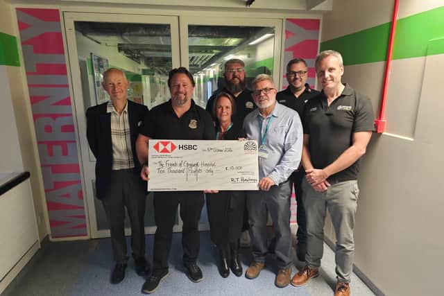 Members of the Hastings Round Table presenting a cheque to The Friends of Conquest Hospital