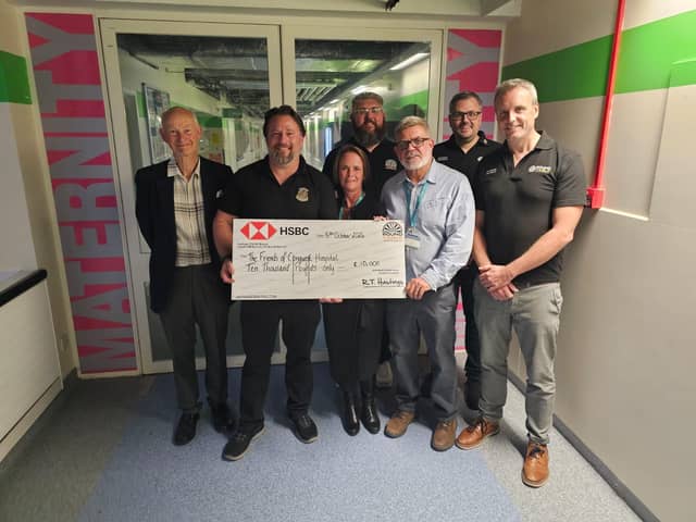 Members of the Hastings Round Table presenting a cheque to The Friends of Conquest Hospital