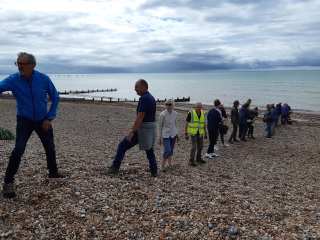A bucket chain of volunteers from Ferring History Group and Ferring Conservation Group, including Worthing West MP Sir Peter Bottomley, form a bucket chain to bail out nine inches of water from the Ferring pillbox
