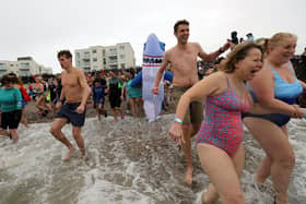 Some 385 people braved the ice cold sea water on New Year's Day 2024. Photos: Chris Hatton