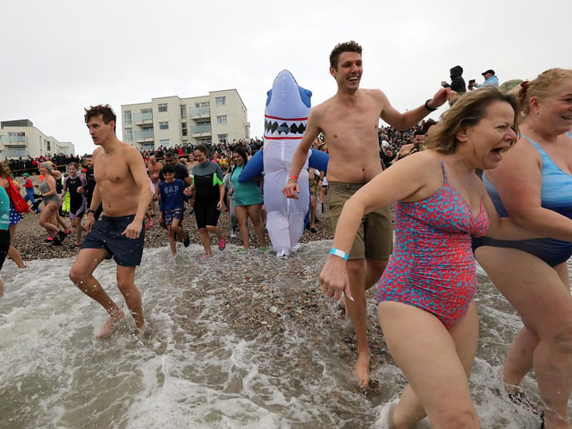 Some 385 people braved the ice cold sea water on New Year's Day 2024. Photos: Chris Hatton