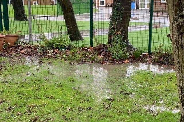 A group of residents are involved in a row with a Worthing primary school after instances of heavy flooding, which they say is destroying their gardens.