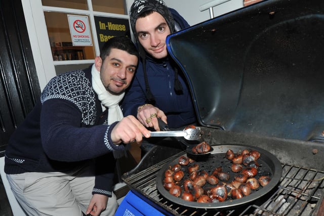 Pantelakis Crawford (L) and Jack Martin (R)  of Peyter Hairdresser with roast chestnuts. December, 2012.