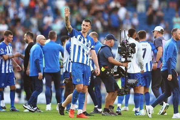 Lewis Dunk of Brighton & Hove Albion acknowledges the fans following the Premier League match against Liverpool