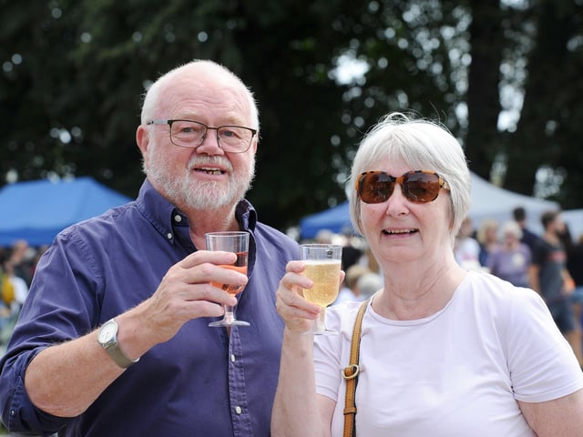 Pictured is: Peter and Carole Donnelly from Hayling Island, enjoy a glass of wine from Bush Vines Picture: Sarah Standing (260824-5611)