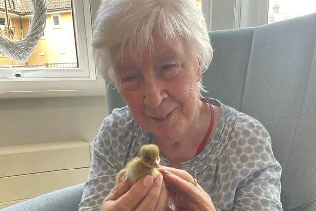 Brenda Field, one of the residents at the home with a duck