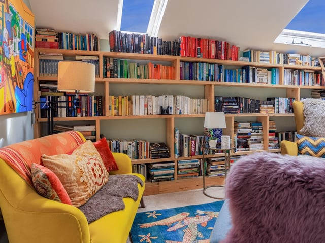 "A home with its very own library, a stunning room serving as both study and reading room. Naturally zoned with fitted shelving reaching up to the sloping ceiling, light pours in through three large skylights."