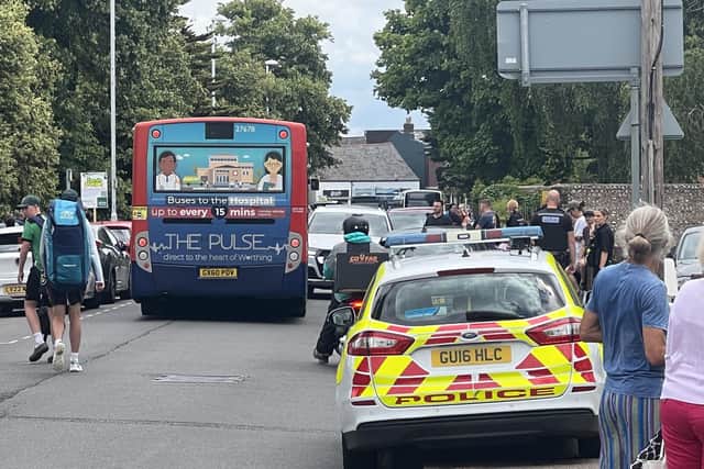 Photos from the scene show a crowd of onlookers blocking the road, whilst police officers questioned a suspect. (Photo contributed)
