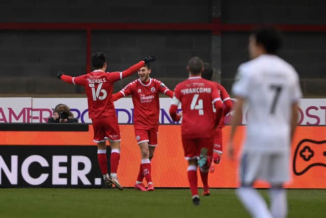 Ashley Nadesan celebrates with Tom Nichols and teammates after scoring their side's second goal during the FA Cup Third Round match between Crawley Town and Leeds United at The Peoples Pension Stadium on January 10, 2021.