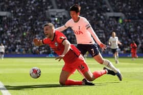 Joel Veltman of Brighton & Hove Albion is challenged by Son Heung-Min of Tottenham Hotspur