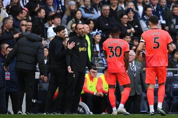 Pervis Estupinan of Brighton & Hove Albion reacts with Cristian Stellini, Interim Manager of Tottenham Hotspur, before the latter is sent off during the Premier League match
