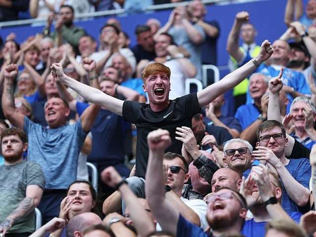 Everton fans celebrate the team's first goal scored by Iliman Ndiaye of Everton (not pictured)